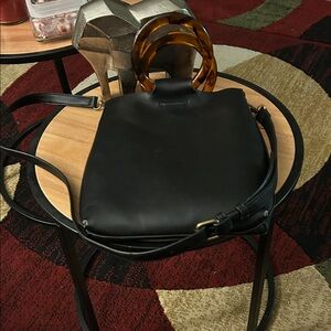 Street Level Black Crossbody Bag with Tortoise Shell Handles